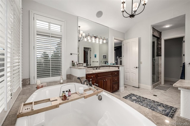 648 Ruby Trust Dr, Castle Rock, CO 80108 - bathroom featuring a garden tub, a chandelier, vanity, vaulted ceiling, and a stall shower