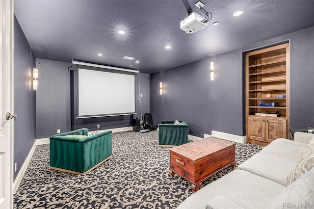 648 Ruby Trust Dr, Castle Rock, CO 80108 - carpeted home theater with recessed lighting, baseboards, a textured ceiling, and built in shelves