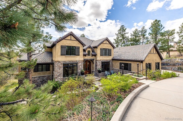 648 Ruby Trust Dr, Castle Rock, CO 80108 - view of front of house featuring stucco siding, stone siding, and a tile roof