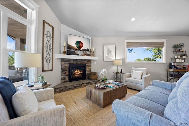 20243 High Pines Dr, Monument, CO 80132 - living room featuring a stone fireplace, lofted ceiling, and recessed lighting
