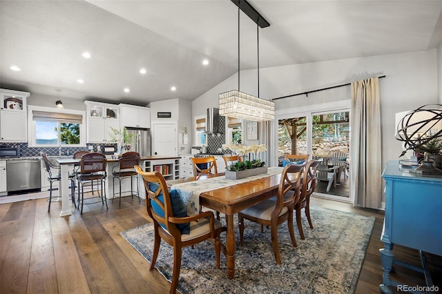 20243 High Pines Dr, Monument, CO 80132 - dining room with recessed lighting, vaulted ceiling, and dark wood-style flooring