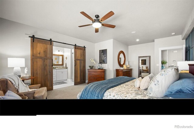 20243 High Pines Dr, Monument, CO 80132 - bedroom featuring a barn door, ensuite bathroom, recessed lighting, a ceiling fan, and baseboards