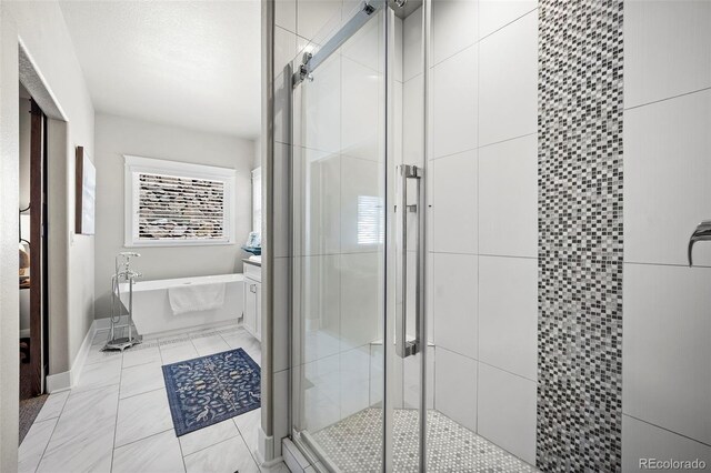 20243 High Pines Dr, Monument, CO 80132 - bathroom featuring a garden tub, a shower stall, and vanity