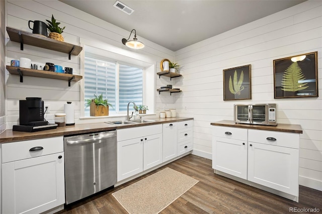 20243 High Pines Dr, Monument, CO 80132 - kitchen with stainless steel dishwasher, wood counters, open shelves, a sink, and dark wood-style flooring