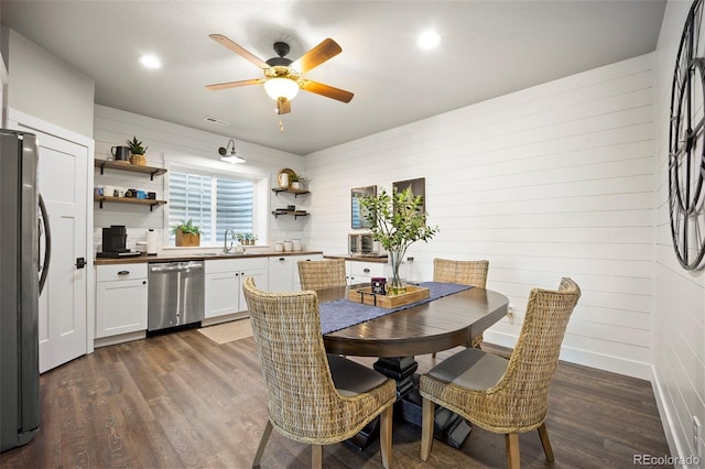 20243 High Pines Dr, Monument, CO 80132 - dining space featuring dark wood finished floors, a ceiling fan, wooden walls, and recessed lighting