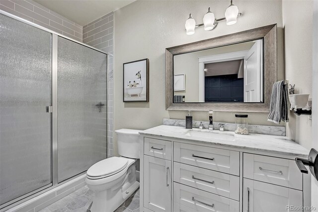 20243 High Pines Dr, Monument, CO 80132 - bathroom with vanity, toilet, and a stall shower