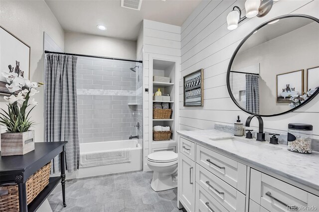 20243 High Pines Dr, Monument, CO 80132 - bathroom with vanity, toilet, shower / bath combo, wood walls, and recessed lighting