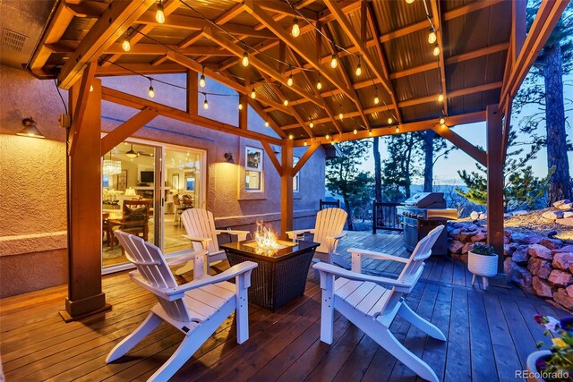 20243 High Pines Dr, Monument, CO 80132 - wooden terrace with an outdoor fire pit and a gazebo