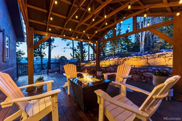 20243 High Pines Dr, Monument, CO 80132 - view of patio with a fire pit, a deck, and a gazebo