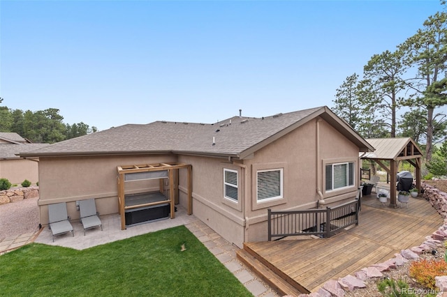 20243 High Pines Dr, Monument, CO 80132 - back of property with a wooden deck, a gazebo, stucco siding, a yard, and a patio area