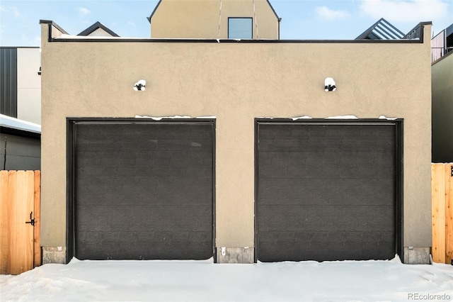 view of snow covered garage