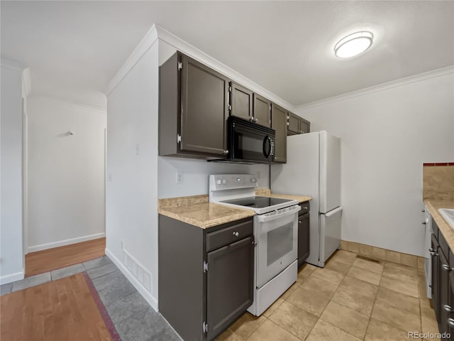 3913 Roosevelt Ave, Wellington, CO 80549 - kitchen featuring crown molding and white electric range oven