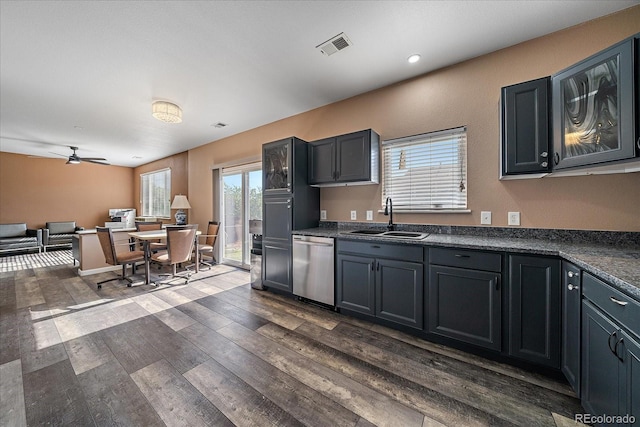 2404 S Genoa Way, Aurora, CO 80013 - kitchen with a sink, stainless steel dishwasher, dark countertops, dark wood finished floors, and ceiling fan