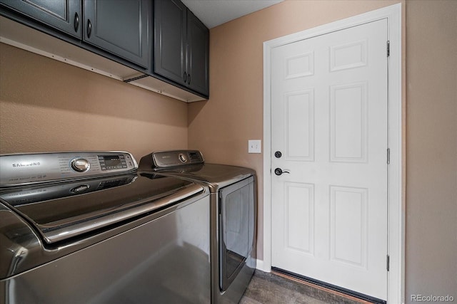 2404 S Genoa Way, Aurora, CO 80013 - washroom featuring separate washer and dryer, cabinet space, and wood finished floors