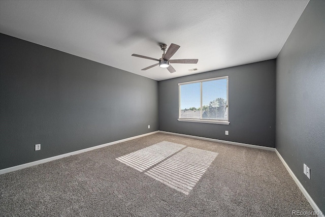 2404 S Genoa Way, Aurora, CO 80013 - empty room with carpet floors, a ceiling fan, and baseboards