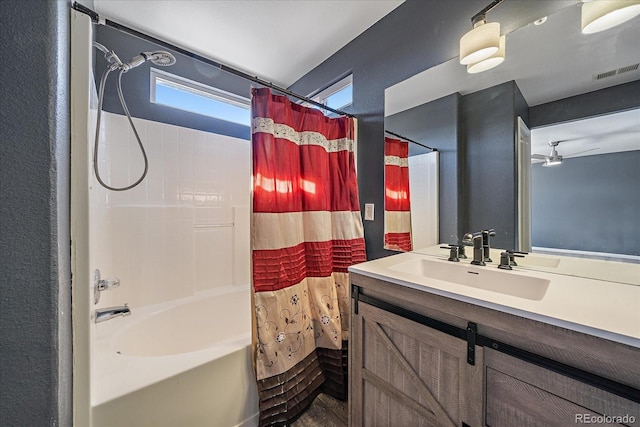 2404 S Genoa Way, Aurora, CO 80013 - bathroom with shower / bath combination with curtain, vanity, and ceiling fan