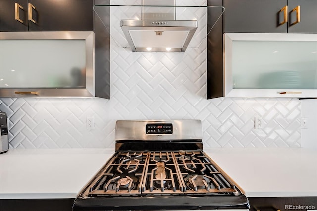 kitchen featuring gas range and light countertops