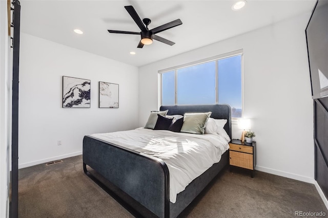 bedroom with dark colored carpet, recessed lighting, ceiling fan, baseboards, and visible vents