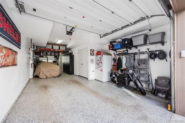 garage featuring a garage door opener