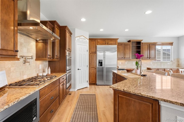 17378 W 78th Dr, Arvada, CO 80007 - kitchen with built in appliances, range hood, a sink, backsplash, and light wood-style floors