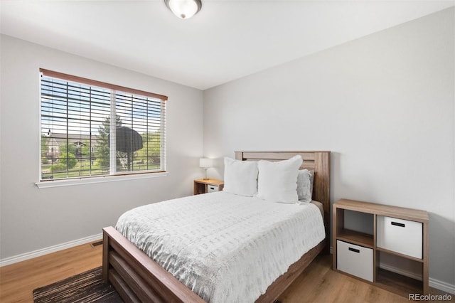 17378 W 78th Dr, Arvada, CO 80007 - bedroom featuring wood finished floors and baseboards