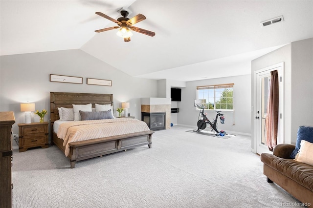 17378 W 78th Dr, Arvada, CO 80007 - bedroom featuring carpet flooring, a fireplace, lofted ceiling, a ceiling fan, and baseboards