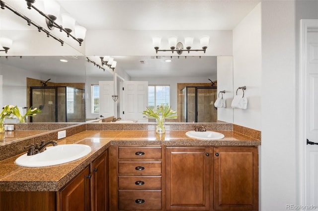 17378 W 78th Dr, Arvada, CO 80007 - bathroom with a stall shower and double vanity