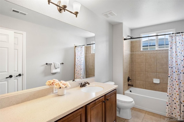 17378 W 78th Dr, Arvada, CO 80007 - full bathroom featuring healthy amount of natural light, tile patterned flooring, vanity, and toilet