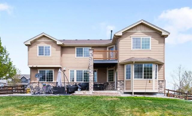 17378 W 78th Dr, Arvada, CO 80007 - back of property featuring a balcony, stone siding, and a patio