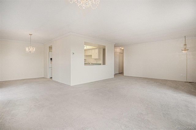 13800 E Marina Dr Unit 601, Aurora, CO 80014 - empty room with a chandelier, ornamental molding, and light colored carpet