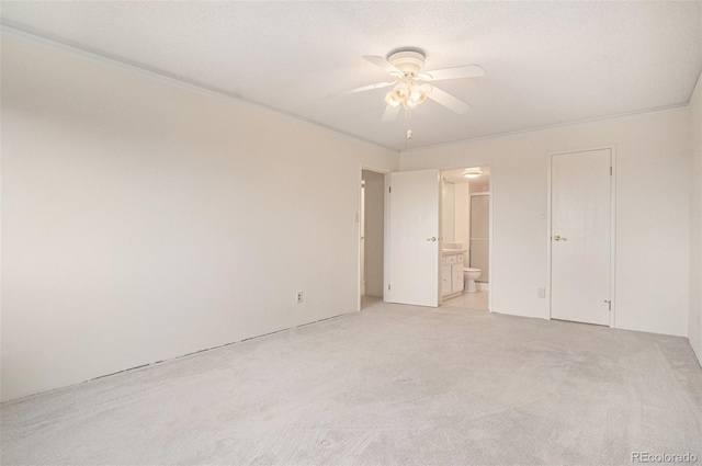 13800 E Marina Dr Unit 601, Aurora, CO 80014 - unfurnished bedroom with light colored carpet, crown molding, connected bathroom, and a ceiling fan