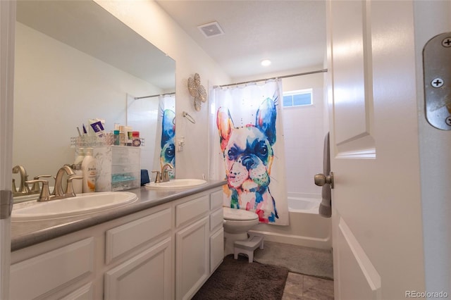 full bathroom featuring shower / bath combination with curtain, double vanity, a sink, and visible vents