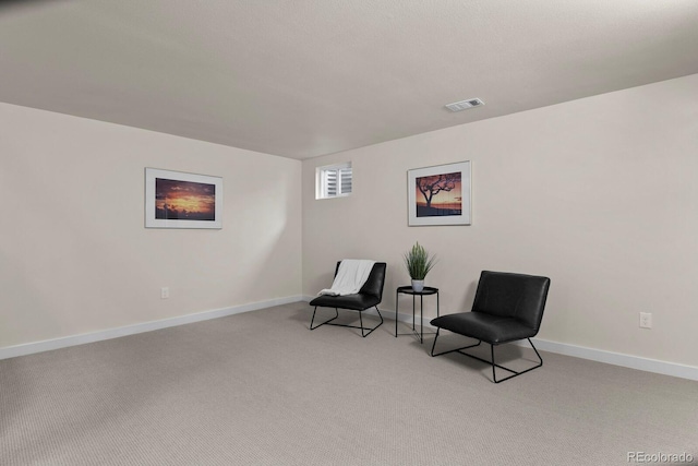 sitting room with light colored carpet