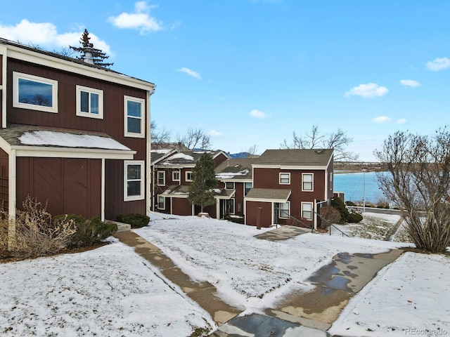 view of front facade with a water view