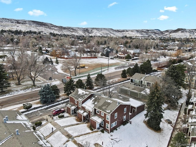 snowy aerial view with a mountain view