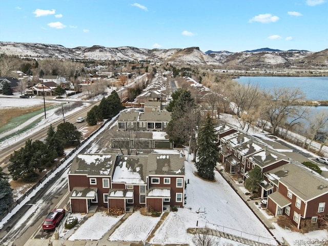 snowy aerial view featuring a mountain view