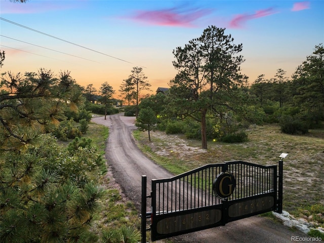 view of gate at dusk