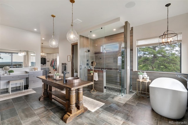 dining area with a wealth of natural light and an inviting chandelier