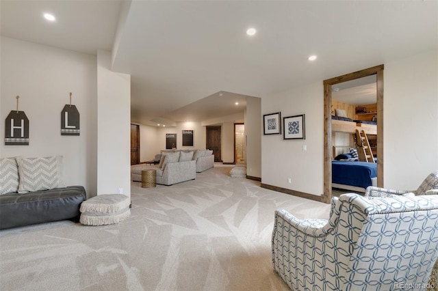 carpeted living room featuring vaulted ceiling