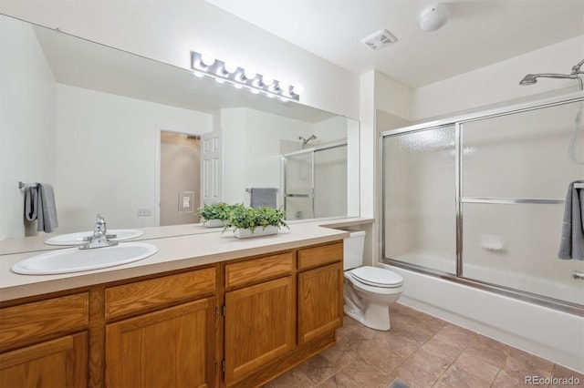 10166 Grove Loop Unit D, Westminster, CO 80031 - full bath featuring vanity, enclosed tub / shower combo, and toilet