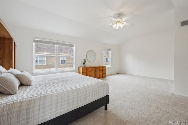 10166 Grove Loop Unit D, Westminster, CO 80031 - bedroom featuring light carpet, vaulted ceiling, ceiling fan, and baseboards