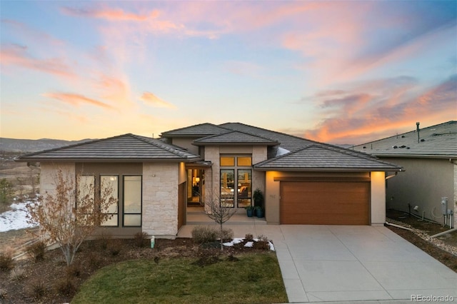 prairie-style home with a garage