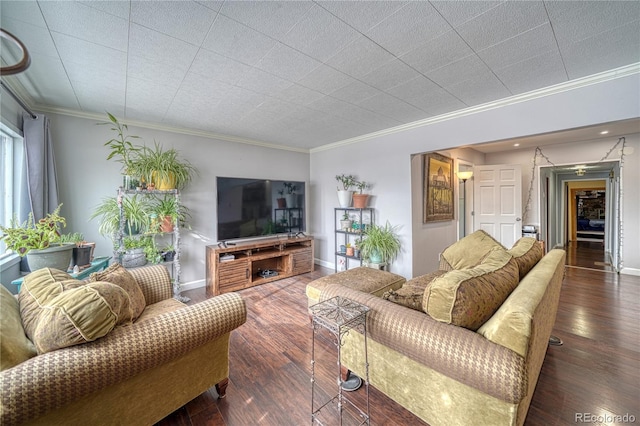 living room with ornamental molding and dark hardwood / wood-style flooring