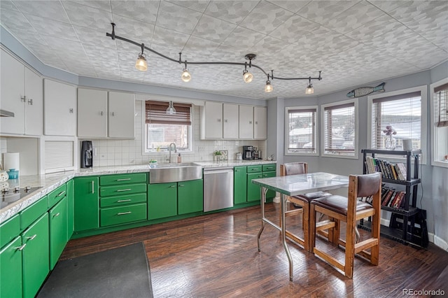 kitchen featuring dark hardwood / wood-style floors, sink, white cabinets, stainless steel dishwasher, and green cabinetry