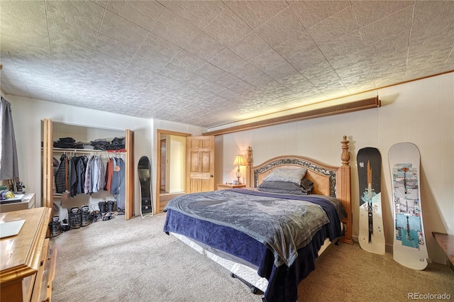 carpeted bedroom with a closet