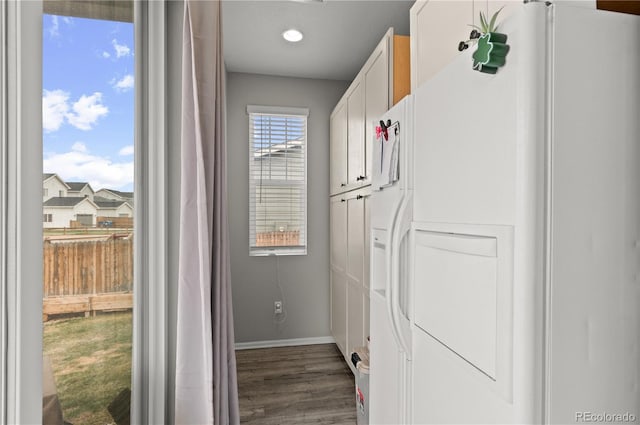9883 Truckee St, Commerce City, CO 80022 - clothes washing area featuring baseboards, recessed lighting, and wood finished floors
