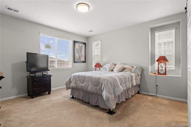 9883 Truckee St, Commerce City, CO 80022 - bedroom with light carpet, visible vents, and baseboards