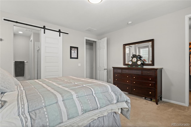 9883 Truckee St, Commerce City, CO 80022 - carpeted bedroom with a closet, baseboards, and a barn door