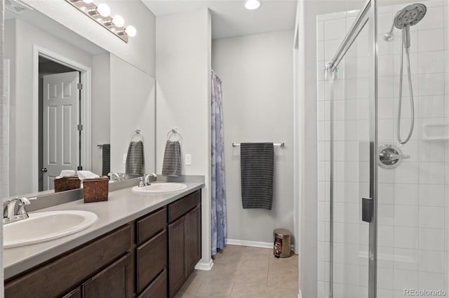 9883 Truckee St, Commerce City, CO 80022 - full bathroom with a tile shower, a sink, tile patterned flooring, and visible vents