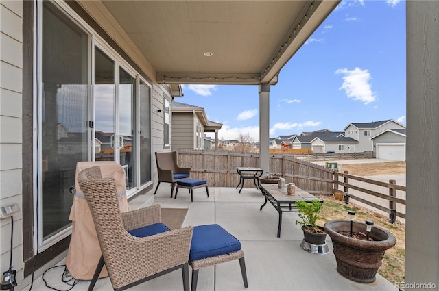 9883 Truckee St, Commerce City, CO 80022 - view of patio featuring a fenced backyard and a residential view